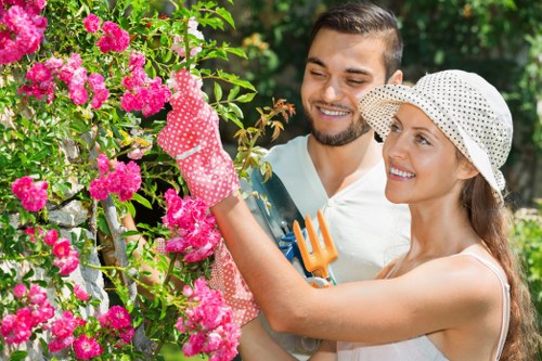 Professional gardener pruning shrubs in Shoreditch